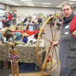 Cole Harmon shows off his great wheel – also known as a muckle wheel – during the Fireweed FiberFest at the Soldotna Regional Sports Complex on Sept. 28, 2019. Harmon spins with qiviut, which is the inner wool of the musk ox and is harvested by Alaska Native elders in Nome. Harmon discovered recently that his wheel was built in the 1750s out of salvaged shipwreck wood by Quakers on the east coast. The wood itself is about 900 years old and was originally harvested in Scotland.