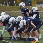 Soldotna senior Matthew Martinelli (upper right) takes the first snap of the game Saturday against Eagle River at Justin Maile Field in Soldotna. (Photo by Joey Klecka/Peninsula Clarion)