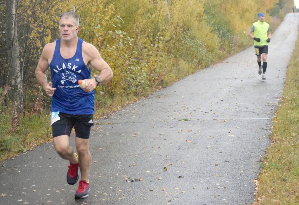 Anchorages Kyle Emery, running the Marathon, leads Kenais Sean Goff, running the Half Marathon, Sunday, Sept. 29, 2019, in the Kenai River Marathon in Alaska. (Photo by Jeff Helminiak/Peninsula Clarion)