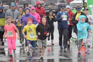 Runners conquer rain, wind at Kenai River Marathon