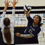 Soldotnas Ituau Tuisaula (right) sends a ball past Nikiskis Kaitlyn Johnson Tuesday, Oct. 1, 2019, at Nikiski High School in Nikiski, Alaska. (Photo by Joey Klecka/Peninsula Clarion)