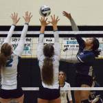 Soldotnas Ituau Tuisaula (right) sends a ball by the Nikiski tandem of Kaycee Bostic and Kaitlyn Johnson Tuesday, Oct. 1, 2019, at Nikiski High School in Nikiski, Alaska. (Photo by Joey Klecka/Peninsula Clarion)