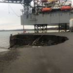 Heavy seas caused an Offshore System Kenai (OSK) earth and fill dock, with fuel lines, to collapse, Oct. 2, 2019, resulting in the discharge of approximately 300 gallons of oil. Inspectors from Coast Guard Marine Safety Detachment Homer responded to the incident and are coordinating with the responsible party and state authorities to mitigate further pollution. The dock continues to erode, but all remaining hazardous materials have been removed. (U.S. Coast Guard courtesy photo)
