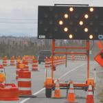 Signs redirecting traffic along the Kenai Spur Highway between Kenai and Soldotna can be seen on Saturday. (Photo by Brian Mazurek/Peninsula Clarion)