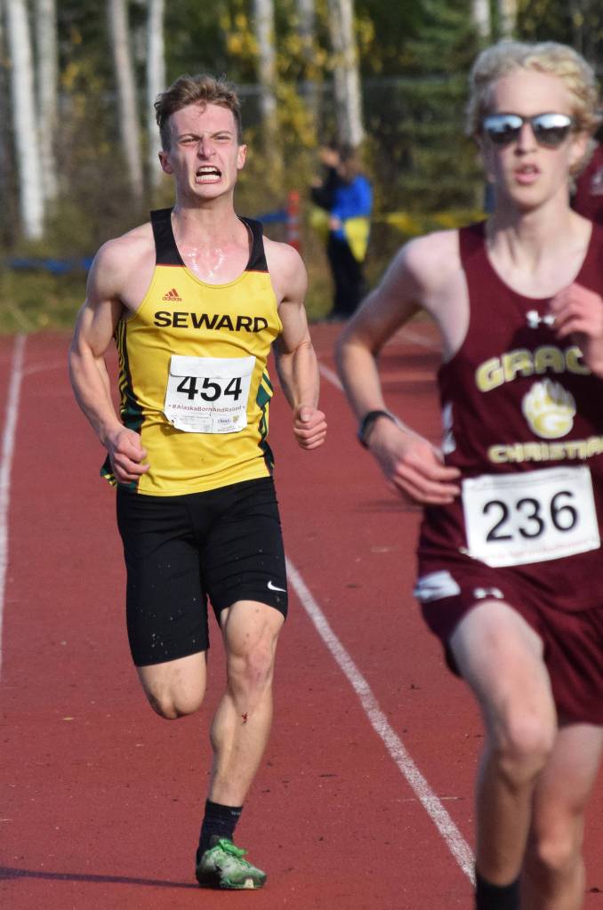 Sewards Trey Ingalls pushes hard to the finish in the Div. II boys state cross-country championships Saturday, Oct. 5, 2019, on the Bartlett High trails in Anchorage, Alaska. (Photo by Joey Klecka/Peninsula Clarion)