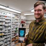 Adam Nelson, a pharmacist at Juneau Drug, displays a drug deactivation bag on Tuesday, Oct. 1, 2019, he gives out with opioid prescriptions. People can use the bag to safely dispose of unused drugs. (Michael Penn | Juneau Empire)
