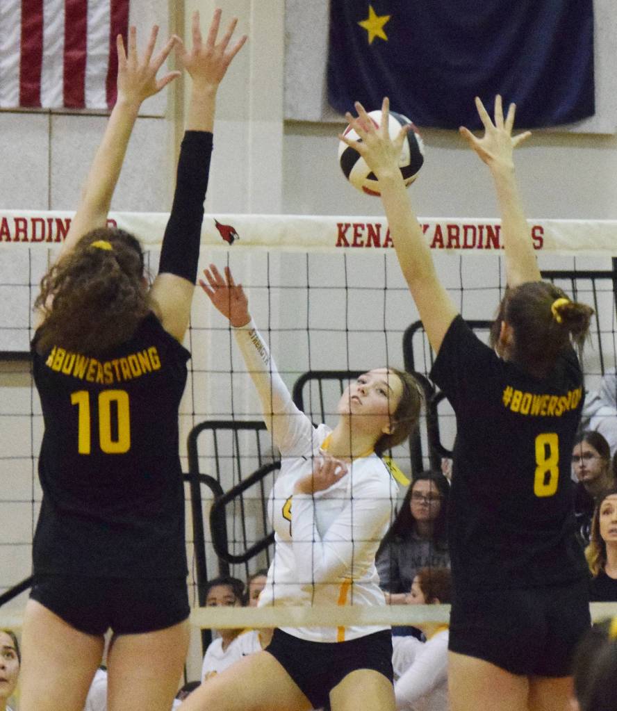 Nikiskis Savannah Ley sends a shot through the Kenai duo of Abby Every (10) and Baileigh Skorupa, Tuesday, Oct. 8, 2019, at Kenai Central High School in Kenai, Alaska. (Photo by Joey Klecka/Peninsula Clarion)