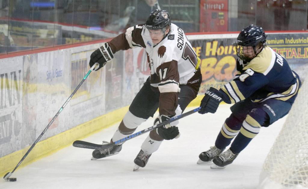 Kenai Rivers Porter Schachle works behind the net against Blake Dangos of the Janesville (Wisconsin) Jets on Friday, Oct. 11, 2019, at the Soldotna Regional Sports Complex in Soldotna, Alaska. (Photo by Jeff Helminiak/Peninsula Clarion)