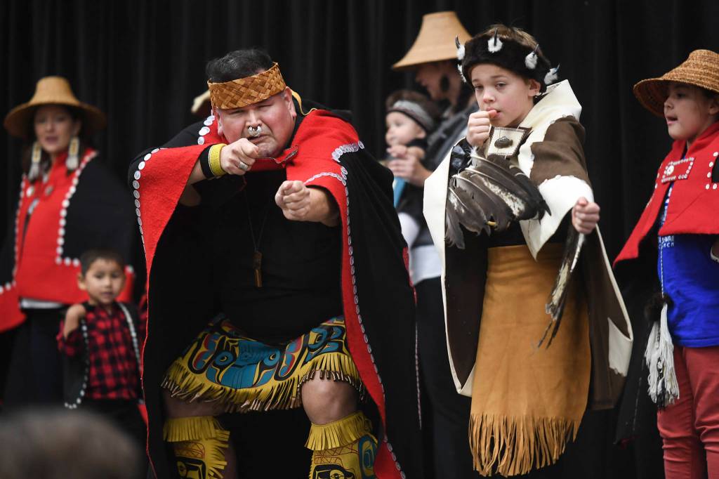 Alfie Price, left, and Tristen Washington, 9, perform with the Xaadaas Dagwii Dance Group for Indigenous Peoples Day at the Elizabeth Peratrovich Hall on Monday, Oct. 14, 2019. (Michael Penn | Juneau Empire)