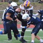 Lathrop running back Josiah Opp gets swarmed by Soldotnas Melvin Lloyd (left) and Jersey Truesdell Friday, Sept. 13, 2019, at Justin Maile Field in Soldotna, Alaska. (Photo by Joey Klecka/Peninsula Clarion)