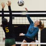 Nikiskis Kaycee Bostic unleashes a shot over Sewards Sofia Perazzi, Thursday, Oct. 17, 2019, at Nikiski High School in Nikiski, Alaska. (Photo by Joey Klecka/Peninsula Clarion)
