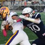 Soldotnas Zach Hanson gets his hands on Lathrops Tyriq Luke on a reception Saturday, Oct. 19, 2019, at the Div. II state football championship at Anchorage Football Stadium in Anchorage, Alaska. (Photo by Joey Klecka/Peninsula Clarion)