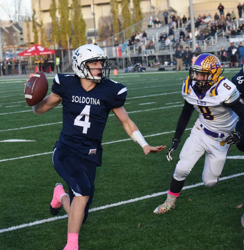 Soldotnas Jersey Truesdell looks for an open receiver Saturday, Oct. 19, 2019, against Lathrop at the Div. II state football championship at Anchorage Football Stadium in Anchorage, Alaska. (Photo by Joey Klecka/Peninsula Clarion)