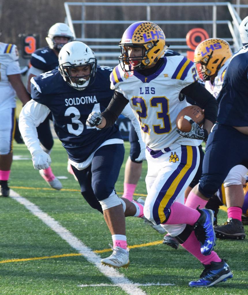 Lathrops Dario Ayala evades the tackle from Soldotnas Aaron Faletoi, Saturday, Oct. 19, 2019, at the Div. II state football championship at Anchorage Football Stadium in Anchorage, Alaska. (Photo by Joey Klecka/Peninsula Clarion)