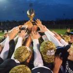 Members of the Soldotna football team celebrate with the Alaska School Activities Association First National Bowl trophy Saturday, Oct. 19, 2019, at the Div. II state football championship at Anchorage Football Stadium in Anchorage, Alaska. (Photo by Joey Klecka/Peninsula Clarion)
