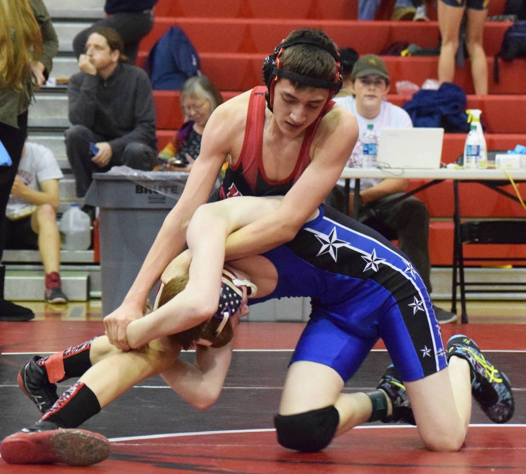 Kenais Owen Whicker works Soldotnas Simon Secor to the ground Saturday, Oct 26, 2019, at the Luke Spruill Memorial Tournament at Kenai Central High School in Kenai, Alaska. (Photo by Joey Klecka/Peninsula Clarion)