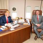 Gov. Mike Dunleavy with President Donald Trump aboard Air Force One in June. (Courtesy photo | White House photographer)