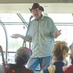 Ben Boettger/Peninsula Clarion file                                Bill Holt tells a fishing tale at Odies Deli on Friday, June 2, 2017, in Soldotna. Holt was among the seven storytellers in True Tales Told Live, an occasional storytelling event co-founded by Pegge Erkeneff, Jenny Neyman and Kaitlin Vadla.