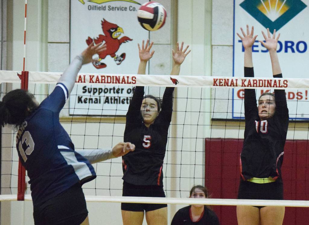 Kenais Chelsea Plagge (left) and Abby Every team up for a block Thursday, Oct. 31, 2019, at Kenai Central High School in Kenai, Alaska. (Photo by Joey Klecka/Peninsula Clarion)