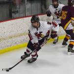 Kenais Nate Beiser skates off with the puck Friday, Nov. 1, 2019, against Dimond JV at the Peninsula Ice Challenge tournament at the Kenai Multi-Purpose Facility in Kenai, Alaska. (Photo by Joey Klecka/Peninsula Clarion)