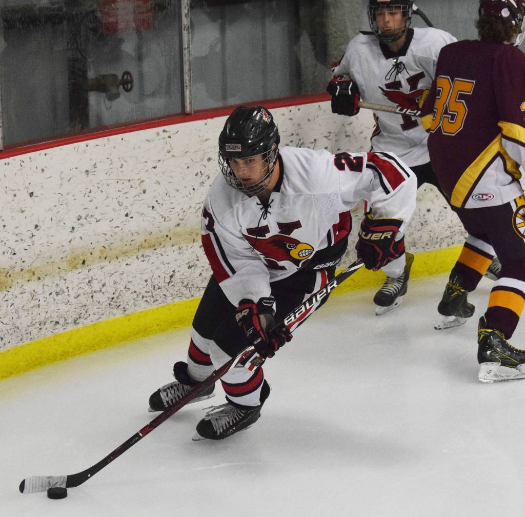 Kenais Nate Beiser skates off with the puck Friday, Nov. 1, 2019, against Dimond JV at the Peninsula Ice Challenge tournament at the Kenai Multi-Purpose Facility in Kenai, Alaska. (Photo by Joey Klecka/Peninsula Clarion)