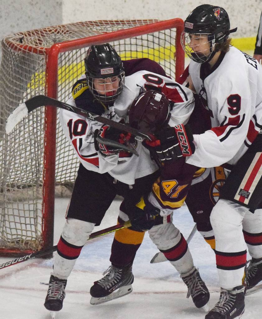 Kenais Jordyn Stock (left) puts Dimonds Preston Horschel in a headlock Friday, Nov. 1, 2019, at the Peninsula Ice Challenge tournament at the Kenai Multi-Purpose Facility in Kenai, Alaska. (Photo by Joey Klecka/Peninsula Clarion)
