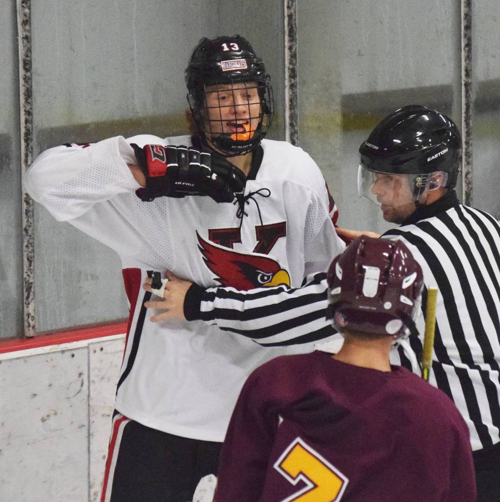 Kenais Aidan Milburn mouths off to Dimonds Preston Horschel, Friday, Nov. 1, 2019, at the Peninsula Ice Challenge tournament at the Kenai Multi-Purpose Facility in Kenai, Alaska. (Photo by Joey Klecka/Peninsula Clarion)