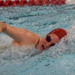 Kenais Rachael Pitsch comes up for air in the girls 200-yard freestyle final Saturday, Nov. 2, 2019, at the Northern Lights Conference swimming and diving championships at Kenai Central High School. (Photo by Joey Klecka/Peninsula Clarion)