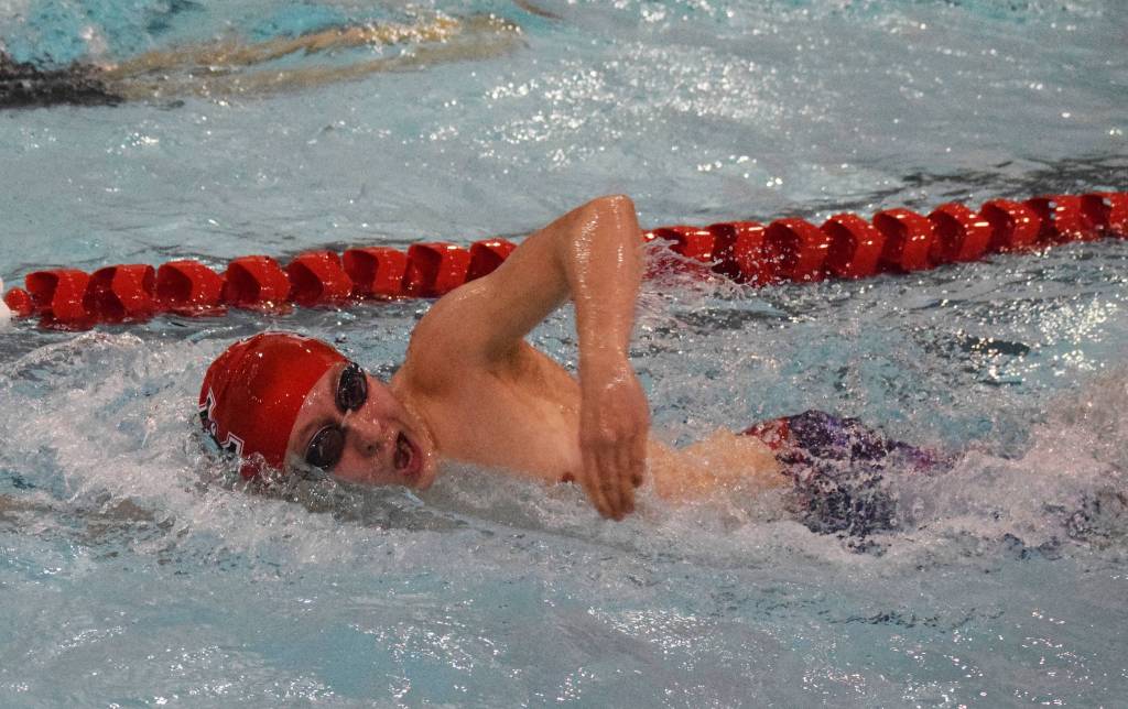 Kenais Koda Poulin races in the boys 500-yard freestyle event Saturday, Nov. 2, 2019, at the Northern Lights Conference swimming and diving championships at Kenai Central High School. (Photo by Joey Klecka/Peninsula Clarion)