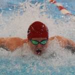 Kenais Owen Rolph races in the boys 100-yard butterfly Saturday, Nov. 2, 2019, at the Northern Lights Conference swimming and diving championships at Kenai Central High School. (Photo by Joey Klecka/Peninsula Clarion)