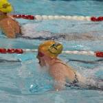Sewards Lydia Jacoby races Homers Madison Story in the girls 200-yard IM Saturday, Nov. 2, 2019, at the Northern Lights Conference swimming and diving championships at Kenai Central High School. (Photo by Joey Klecka/Peninsula Clarion)