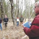 Dr. Alan Boraas leads a tour of Kalifornsky Village, a former Native settlement, in April 2014. Boraas was a professor of anthropology at Kenai Peninsula College, an honorary member of the Kenaitze Indian Tribe and the driving force behind the creation, maintenance and expansion of the Tsalteshi Ski Trails. (Photo courtesy of Jenny Neyman)
