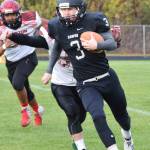Nikiski running back Sam Berry carries the ball against Houston, Friday, Sept. 20, 2019, at Nikiski High School. (Photo by Joey Klecka/Peninsula Clarion)