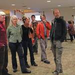 Artist Asia Freeman speaks to visitors at a First Friday art exhibit opening featuring pieces by students in a college class she teaches, on Friday, Nov. 1, 2019 at Kachemak Bay Campus in Homer, Alaska. (Photo by Megan Pacer/Homer News)
