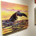 Paintings by students in Asia Freemans art class taught at Kachemak Bay Campus hang on the wall during a First Friday art exhibit opening Friday, Nov. 1, 2019 at the campus in Homer, Alaska. (Photo by Megan Pacer/Homer News)