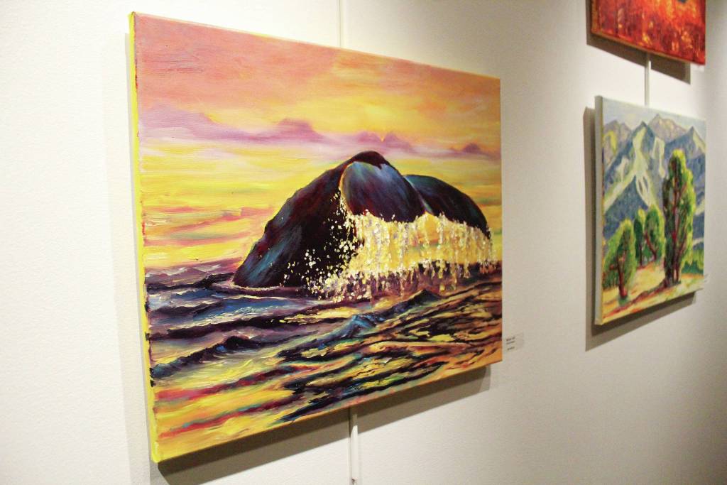 Paintings by students in Asia Freemans art class taught at Kachemak Bay Campus hang on the wall during a First Friday art exhibit opening Friday, Nov. 1, 2019 at the campus in Homer, Alaska. (Photo by Megan Pacer/Homer News)