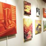 Artwork by students in an art class taught by Asia Freeman hangs on the wall during a First Friday exhibit opening Friday, Nov. 1, 2019 at Kachemak Bay Campus in Homer, Alaska. (Photo by Megan Pacer/Homer News)