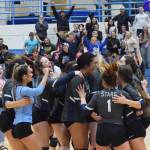 The Soldotna volleyball team celebrates on the floor after beating Wasilla Thursday, Nov. 7, 2019, at the Northern Lights Conference tournament at Soldotna High School in Soldotna, Alaska. (Photo by Joey Klecka/Peninsula Clarion)