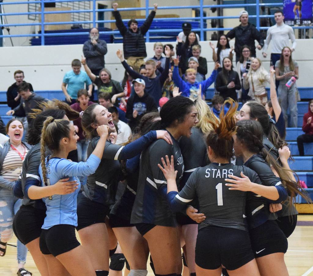 The Soldotna volleyball team celebrates on the floor after beating Wasilla Thursday, Nov. 7, 2019, at the Northern Lights Conference tournament at Soldotna High School in Soldotna, Alaska. (Photo by Joey Klecka/Peninsula Clarion)