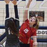 Wasillas Bella Hays sends a ball over the hands of Soldotnas Trayce Lyon, Thursday, Nov. 7, 2019, at the Northern Lights Conference tournament at Soldotna High School in Soldotna, Alaska. (Photo by Joey Klecka/Peninsula Clarion)