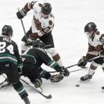 Kenai River Brown Bears forwards Laudon Poellinger and Peter Morgan battle with Brendan Ogle and Jaden Grant of the Chippewa (Wisconsin) Steel on Friday, Nov. 8, 2019, at the Soldotna Regional Sports Complex in Soldotna, Alaska. (Photo by Jeff Helminiak/Peninsula Clarion)