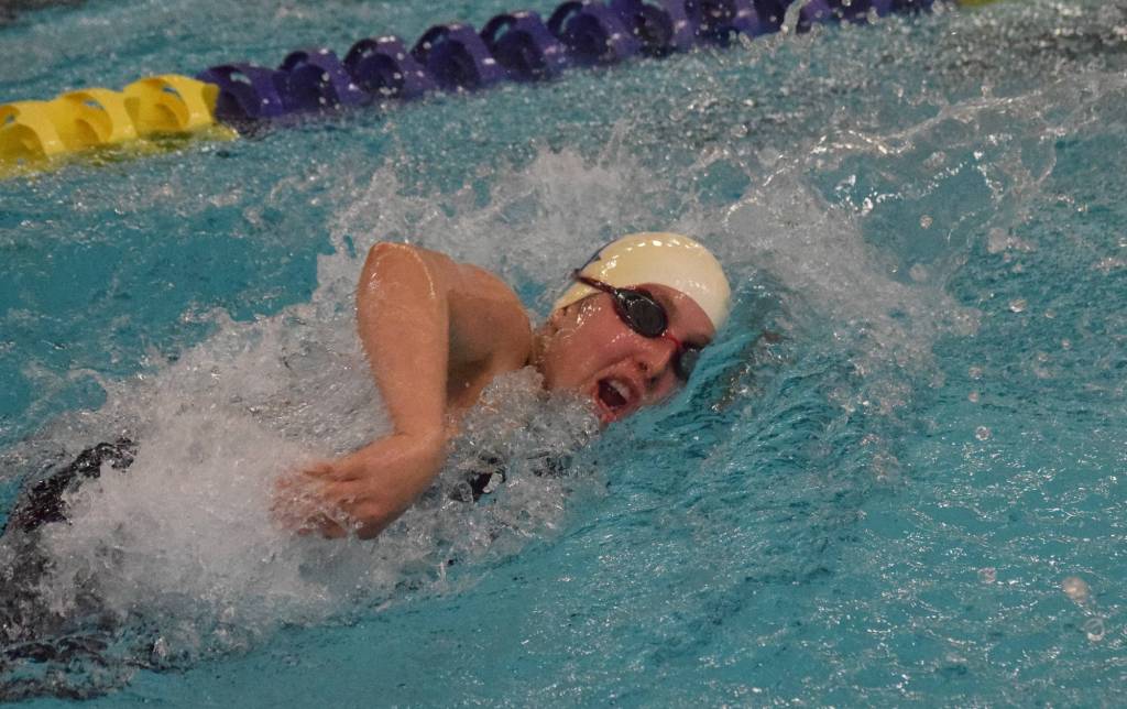 Soldotnas Alex Juliussen races her leg in the girls 200-yard freestyle relay final Saturday, Nov. 9, 2019, at the ASAA state swimming and diving championship at the Bartlett pool in Anchorage, Alaska. (Photo by Joey Klecka/Peninsula Clarion)