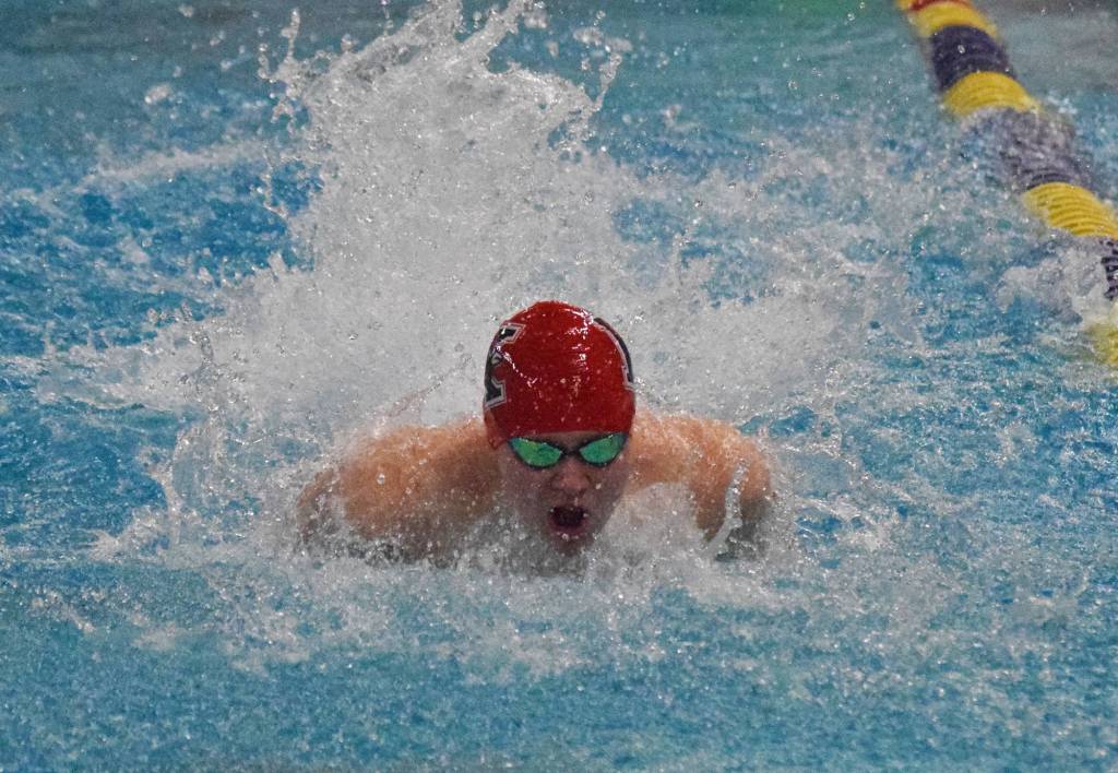 Kenai Centrals Owen Rolph races in the boys 100-yard butterfly final Saturday at the ASAA state swimming and diving championship at the Bartlett pool in Anchorage. (Photo by Joey Klecka/Peninsula Clarion)
