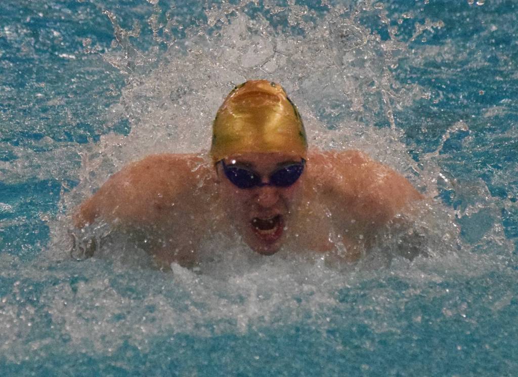 Sewards Connor Spanos races to a podium finish in the boys 100-yard butterfly final Saturday, Nov. 9, 2019, at the ASAA state swimming and diving championship at the Bartlett pool in Anchorage, Alaska. (Photo by Joey Klecka/Peninsula Clarion)