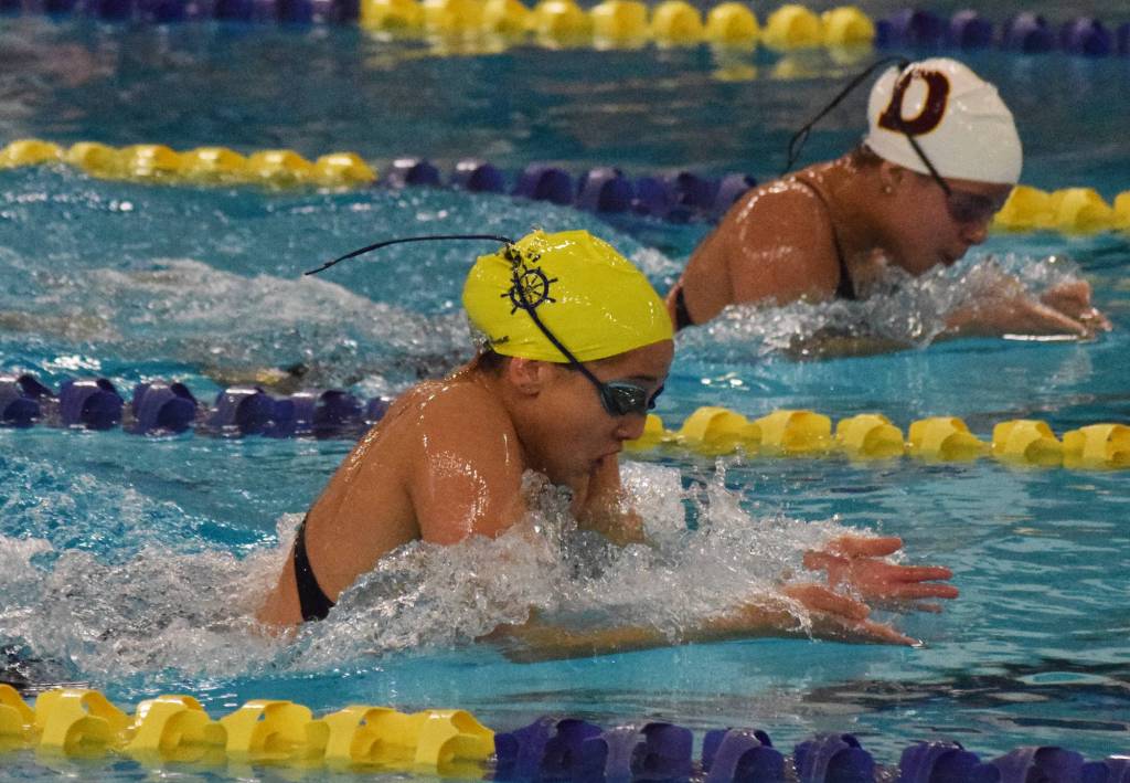 Homers Madison Story leads Dimonds Dreamer Kowatch midway through the girls 200-yard IM final Saturday at the ASAA state swimming and diving championship at the Bartlett pool in Anchorage. (Photo by Joey Klecka/Peninsula Clarion)