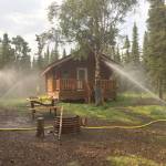 Sprinklers were used as one part of the structure protection plan for the Kelly Lake cabin. (Photo provided by Kenai National Wildlife Refuge)