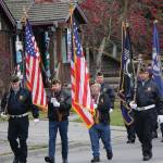 Members of the Veterans of Foreign Wars, Anchor Point Post, the American Legion Post 16 and the Sons of the American Legion Post 16 march on Pioneer Avenue in Veterans Day ceremonies on Nov. 11, 2019,in Homer, Alaska. (Photo by Michael Armstrong / Homer News)