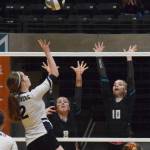 Nikiskis Kaitlyn Johnson (left) and Lillian Carstens team up for a block against Homers Laura Inama, Thursday, Nov. 14, 2019, at the Class 3A state volleyball tournament at the Alaska Airlines Center in Anchorage, Alaska. (Photo by Joey Klecka/Peninsula Clarion)