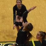 Nikiskis Jaycee Tauriainen watches as teammate Lillian Carstens hits a ball Thursday, Nov. 14, 2019, against Monroe Catholic at the Class 3A state volleyball tournament at the Alaska Airlines Center in Anchorage, Alaska. (Photo by Joey Klecka/Peninsula Clarion)