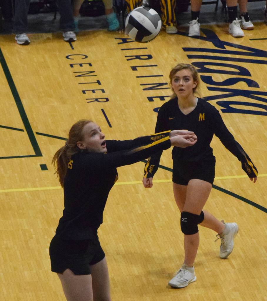 Homers Sela Weisser watches as teammate Kelli Bishop sets up a ball Friday, Nov. 15, 2019, against Barrow at the Class 3A state volleyball tournament at the Alaska Airlines Center in Anchorage, Alaska. (Photo by Joey Klecka/Peninsula Clarion)